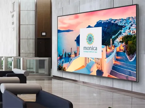 a large screen on the wall of a lobby