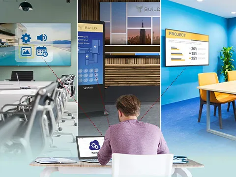 a man working on a laptop connected to a variety of displays with the software
