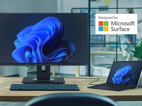 a surface laptop connected to a monitor designed for surface