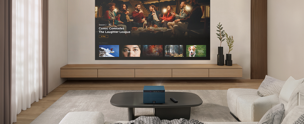 a projector on a table in a living room aimed at a wall