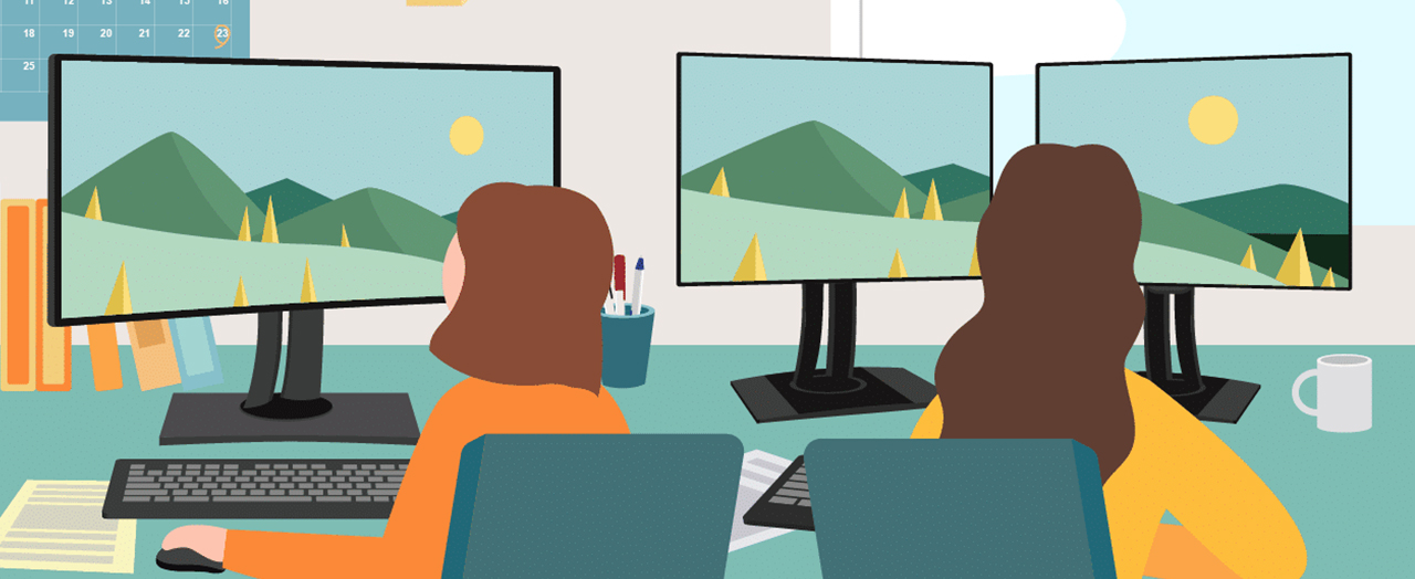 two people work side-by-side.  one uses two monitors while the other uses an ultrawide display