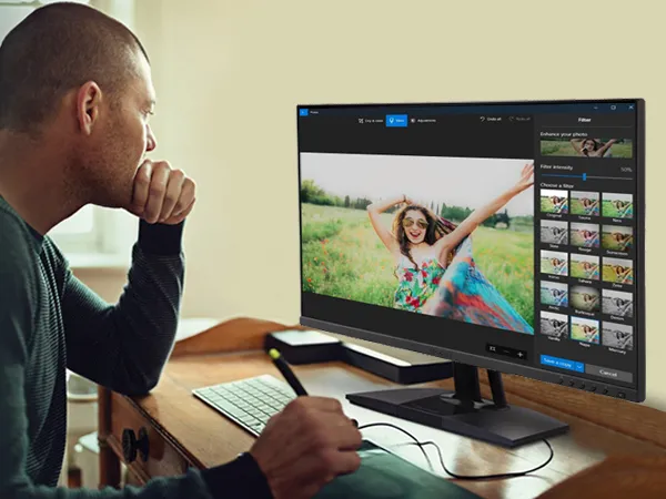 man working on a tablet to create images in Photoshop