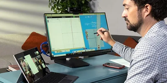 man annotating on a touch screen monitor