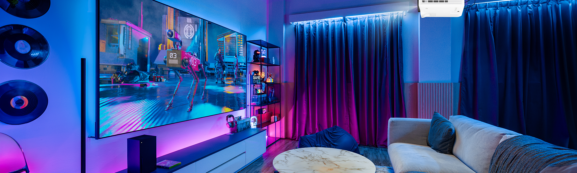 large screen on the wall with a game being projected by a ViewSonic gaming projector